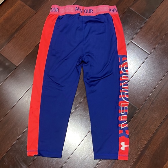 Blue and pink children’s Under Armour capri-styled leggings. - Picture 2 of 4